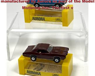 Lot 1598 2 HO scale electric slot cars manufactured by Aurora as part of the Model Motoring line. The first v