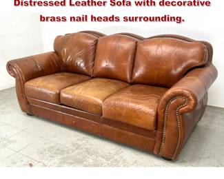Lot 1395 Robertson and Robertson Distressed Leather Sofa with decorative brass nail heads surrounding.