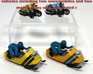 Lot 1565 4 vintage HOscale slot car vehicles including two snowmobiles and two motorcycles with integrated r