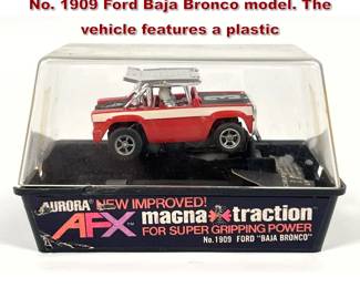 Lot 1574 Aurora AFX electric slot car is the No. 1909 Ford Baja Bronco model. The vehicle features a plastic 