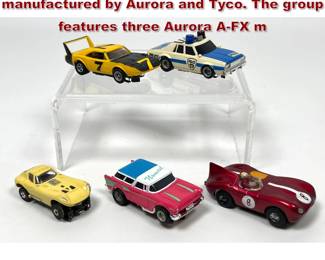 Lot 1570 5 vintage HO scale slot cars manufactured by Aurora and Tyco. The group features three Aurora AFX m