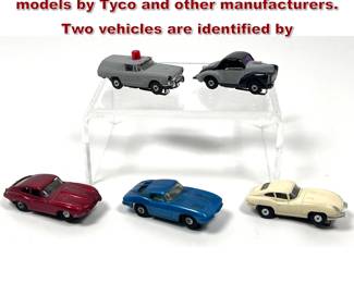 Lot 1580 5 HO scale slot cars includes models by Tyco and other manufacturers. Two vehicles are identified by