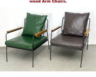 Lot 1344 2pcs Primo International Iron and wood Arm Chairs. 