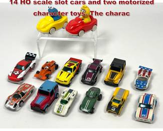 Lot 1585 16 vintage toy vehicles including 14 HO scale slot cars and two motorized character toys. The charac