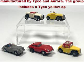 Lot 1583 5pcs vintage HO scale slot cars manufactured by Tyco and Aurora. The group includes a Tyco yellow op