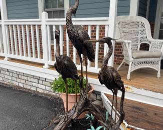 Bronze cranes, which are also plumbed to be fountains