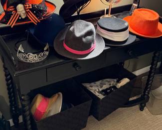 Hats, sleek black table