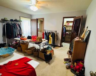 Lots of clothing, items, purses, baskets, jewelry, case, stand, and more