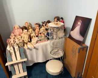 Lots  of vintge dolls, vintage bird cage and vanity stool and a second fabulous wedding dress in the box. 