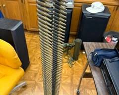 130-round machine-gun ammunition belt with original disintegrating metallic links (empty fired cases).