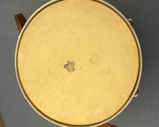 Vintage WFL Drum Co. marching snare drum, Chicago, Illinois. Pre-Ludwig era WFL badge, original hardware, strap, and carrying case. Approximately 14½" diameter x 7" deep. Bottom head damaged; otherwise a nice vintage percussion collectible.