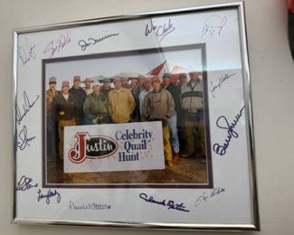 Our client (standing to Nolan's right) and his son both attended the Justin Celebrity Quail Hunt Charity event . Besides getting to quail hunt you also got your picture taken with Nolan and his buddies and then after that they signed it for you!