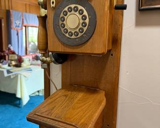 Wall telephone wired to work, oak case