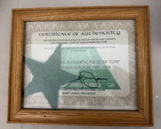A piece of turf from Texas Stadium signed by Jerry
