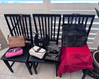 Part of our designer purse collection. Coach, Prada, Fendi, and more!