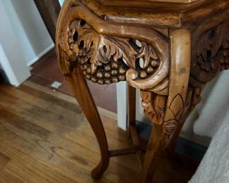 Carved plant stand