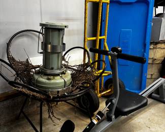 Vintage kerosene heater, rowing machine, flower chair frame