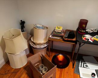 Antique lamp pieces, reverse painted glass bowl, small wooden table, tons of lamp shades.