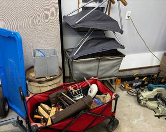 Tools, antique cotton industrial basket, Makita saw, Dewalt tough-built horses. Red garden truck not for sale. Old wooden barrel.