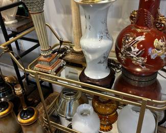 Vintage bar cart, various shades, mid century lamps galore.