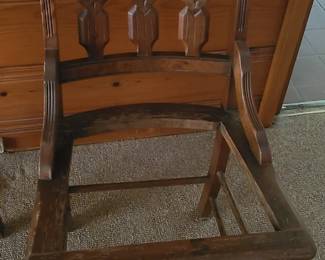 Two wood and cane chairs, cane has been removed.