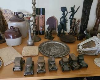 Car banks, antique light fixture, collectibles from Africa, Spain, India, and Mediterranean and countries.