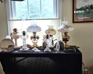 Oil lamps, some converted to electric, (items sold separately).