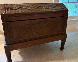 Carved chest on stand