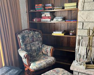 Glider chair with ottoman, books