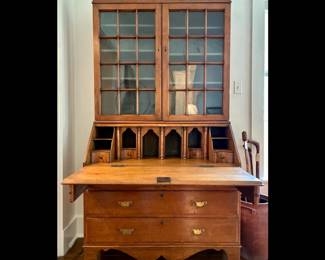 Early American Cherry Wood Bookcase-on-Desk, probably 18th century, extensive hand made interior fittings 4 secret compartments, T & C Clark embossed hinges, 12 lite glass doors, many with original glass, excellent condition, recently professionally waxed, two parts. 81 high by 42 wide by 21 deep
