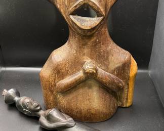 African zoomorphic Senufo bust, and an ebony figural carving