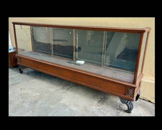 Antique Showcase Cabinet 8 feet long. Glass shelves included.