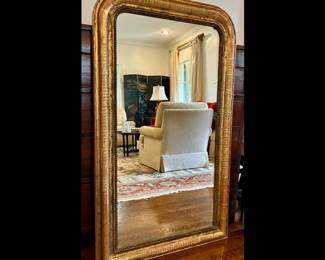 Antique French Louis Philippe mirror in pure gold leaf with sgraffito banding. 49 high by 29 wide