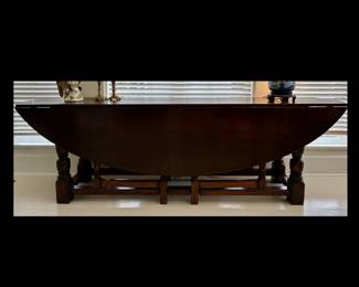 Monumental early 20th century English Wake gate leg dark stained solid oak dining table