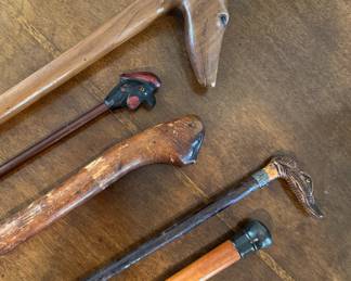 Collection of antique walking sticks, including carved figural, Sterling tops, Japanese, exotic woods.