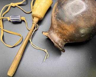 Native American horn rattle, trade bead, and an olla