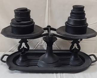 Vintage cast iron balance scale with weights
