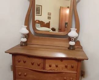 Oak dresser with beveled edge mirror, pair of hobnail milk glass boudoir lamps