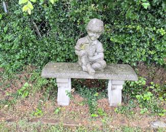 Concrete Statue of a boy on Concrete Bench
