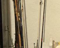 Large lot of vintage fishing poles - some with reels