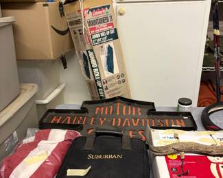 Wind chimes, tent, Harley Davidson sign, flag