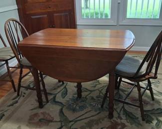 Drop leaf dining table with six chairs