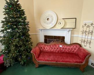 Antique Victorian tufted sofa; ornate carved wooden crest & deep button tufting; walnut; Project piece as it needs to be reupholstered, but absolutely beautiful!