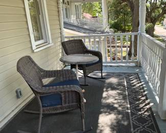 outdoor rockers and antique metal base granite top table