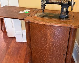 Antique 1917 White Family Treadle sewing machine set in a tiger oak parlor cabinet; non-electric, foot powered, new leather belt;  Sews beautifully!