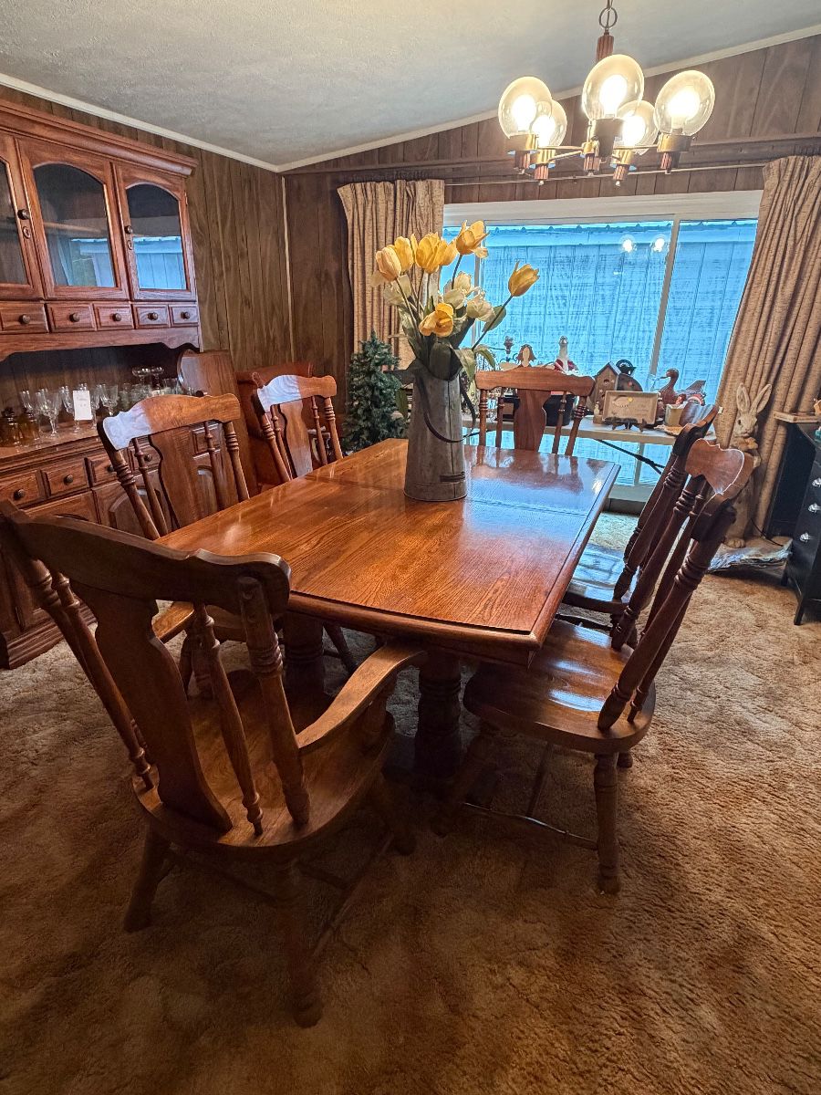 Dining room table set with six chairs with matching hutch