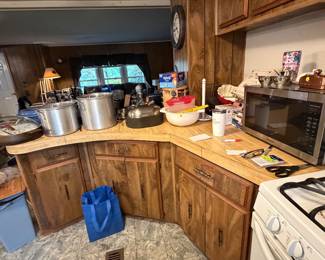 Various kitchen items including pots and pans, microwave etc..