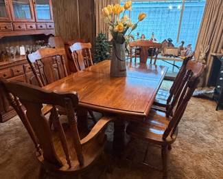 Dining room table set with six chairs with matching hutch