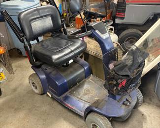Four wheeled mobility scooter with basket