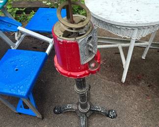 Vintage Red Cast Metal Gumball Machine with Ornate Cast Iron Base